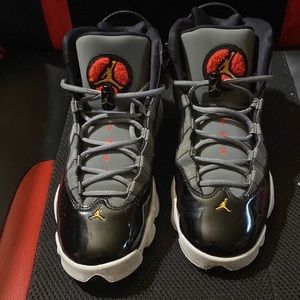 Woman’s Jordans size 7 red,black,gray,and gold.